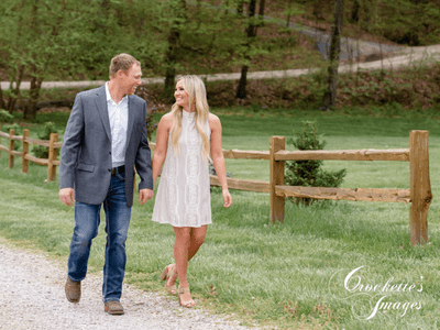 Spring, Classy, Elegant Country Engagement Photo with couple walking on a gravel road holding hands