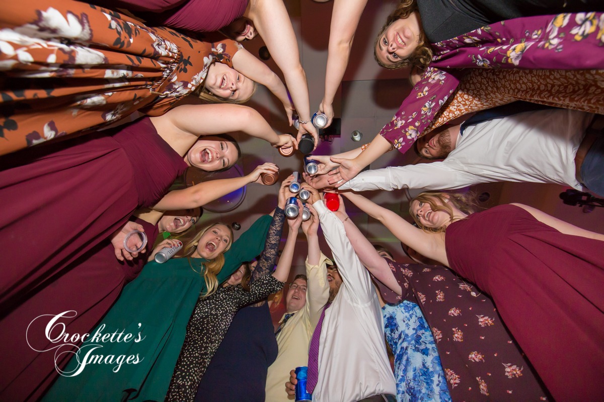 Wedding Reception with everyone cheersing beers