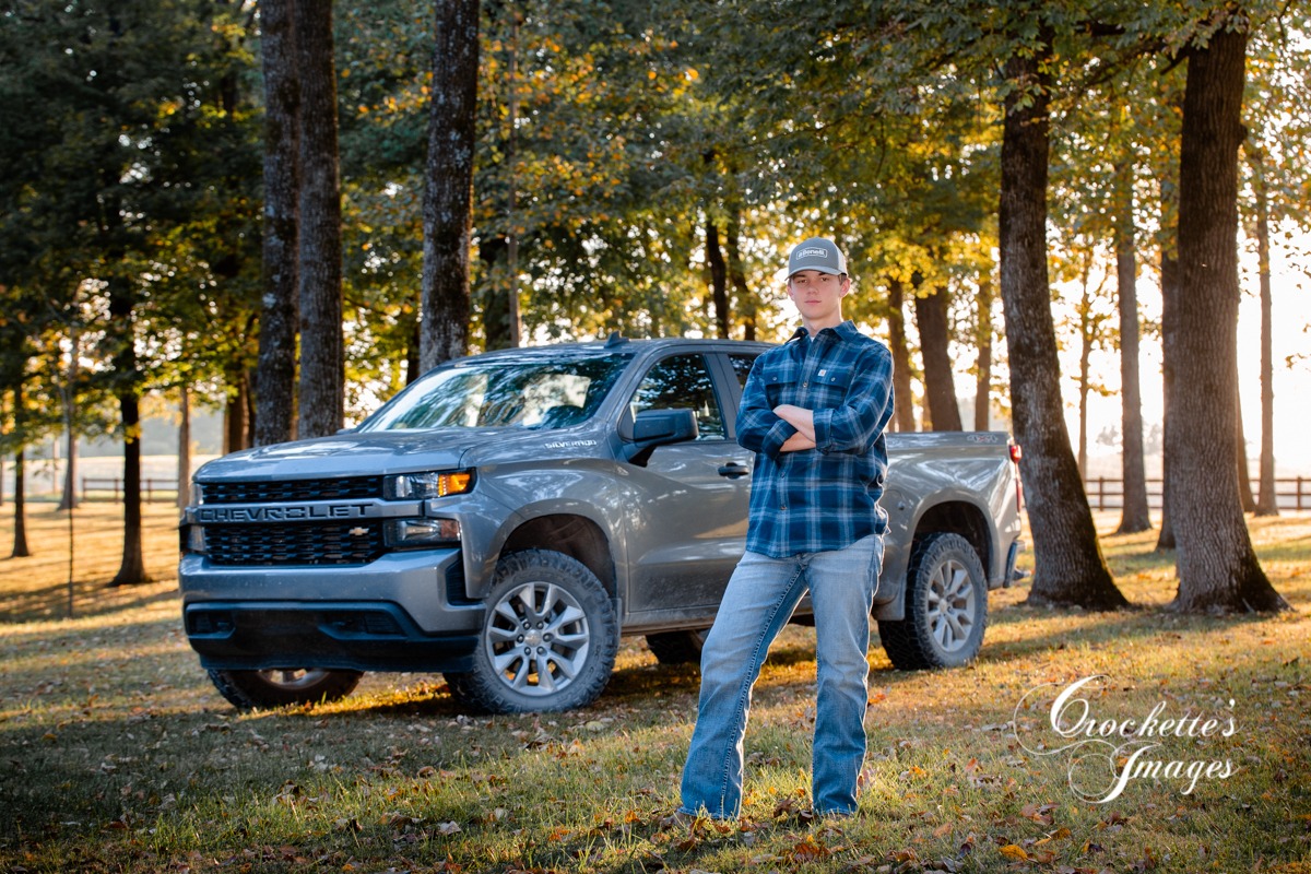 Country Boy senior photo with his truck at sunset