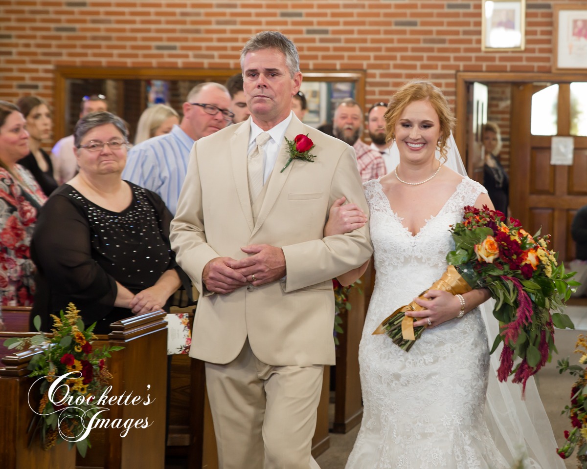 Catholic Wedding Ceremony as a Father walk his daughter down the isle