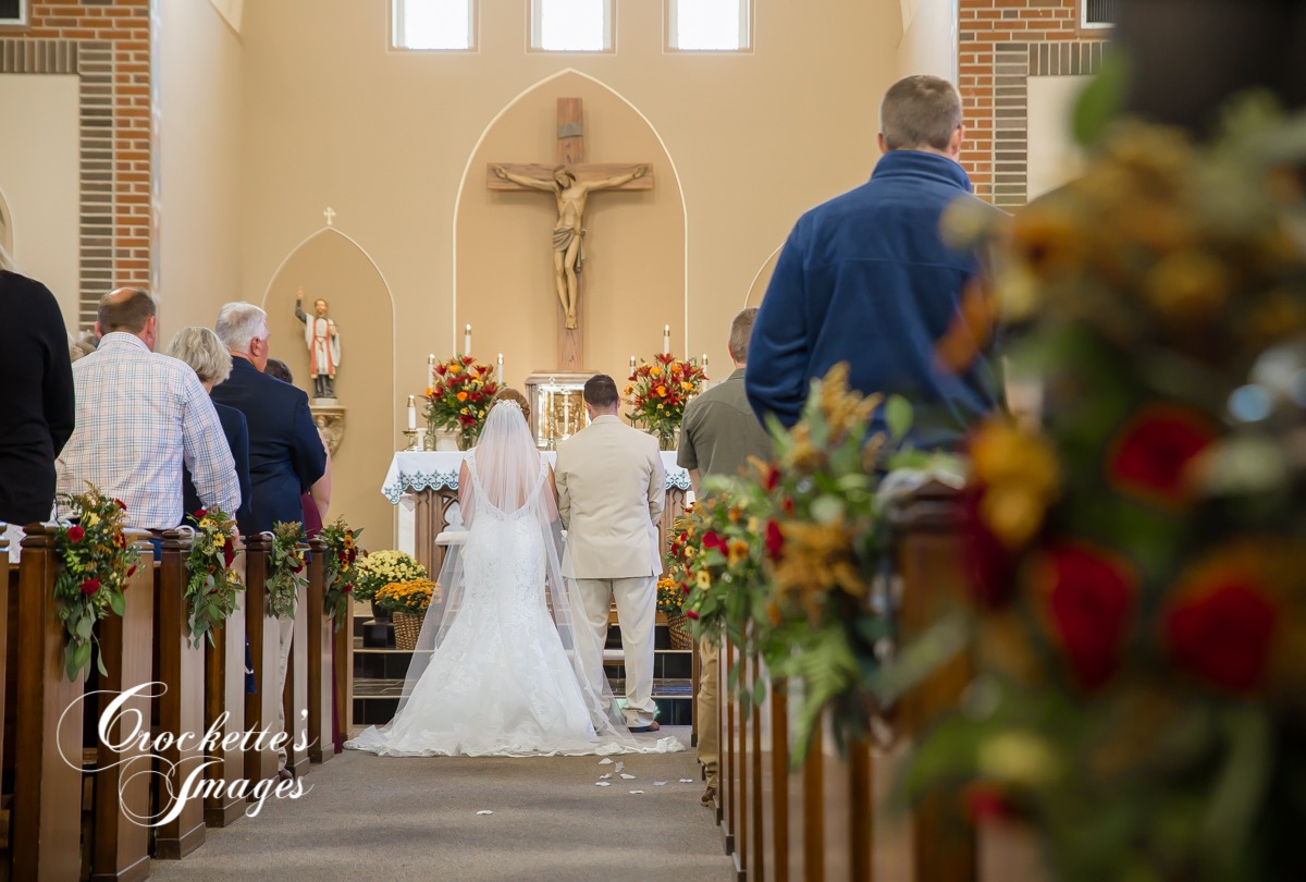 Catholic Wedding Ceremony with couple at alter