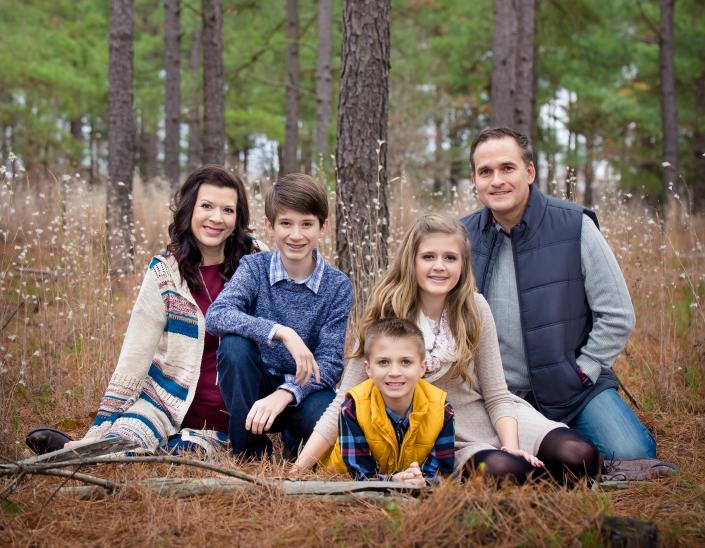 Winter Family Photo in a pine tree forest
