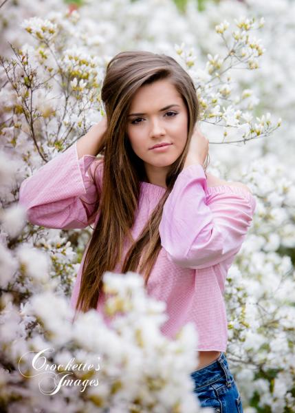 Spring senior girl photo surrounded by white azalea flowers