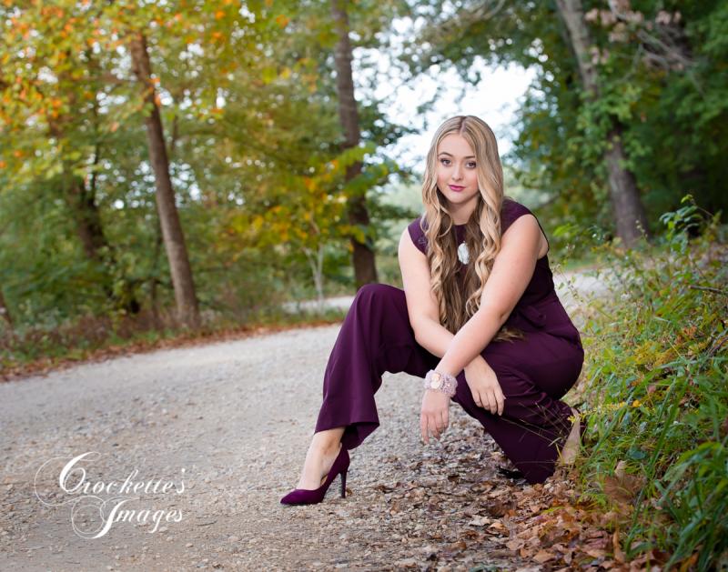 Sassy and powerful fall senior girl photo in purple paint suit