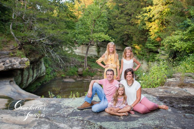 Spring Family Photo in a creek. Soft pink, white, and yellow clothing color scheme.