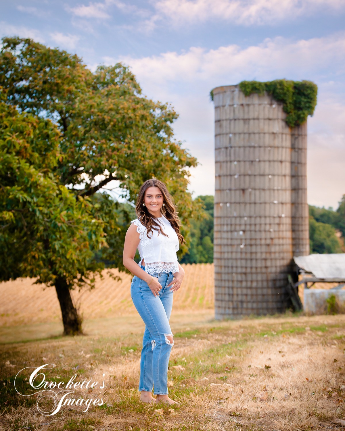 Fun Classy Country Girl Senior Photos with an old grain silo