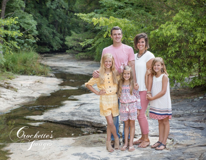 Spring Family Photos in a creek. Light pink, white, and yellow clothing color scheme.