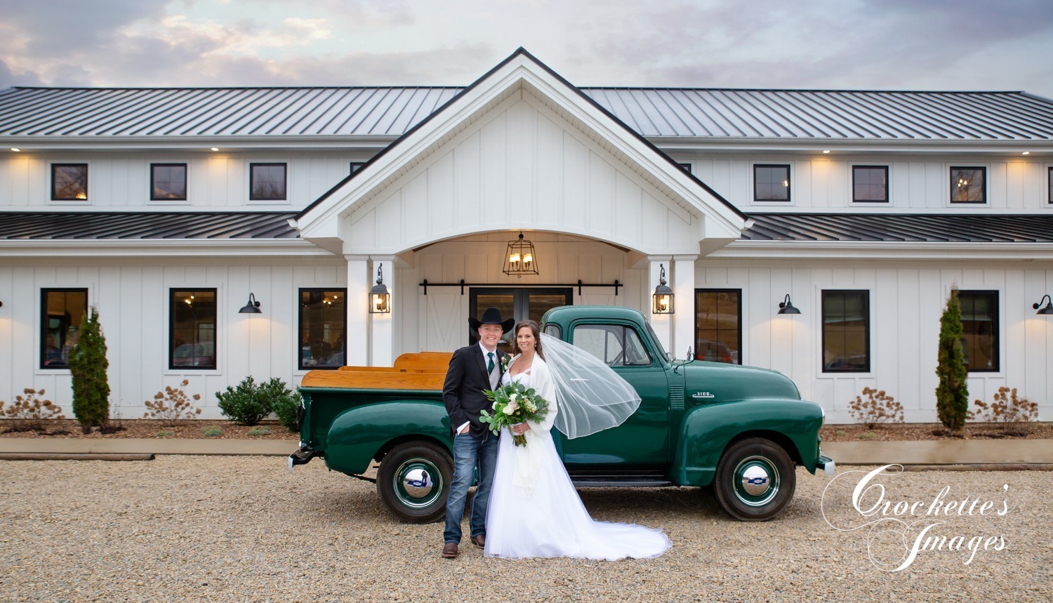Wedding Photos with a truck and blowing veil at Knollcrest in Jackson, MO
