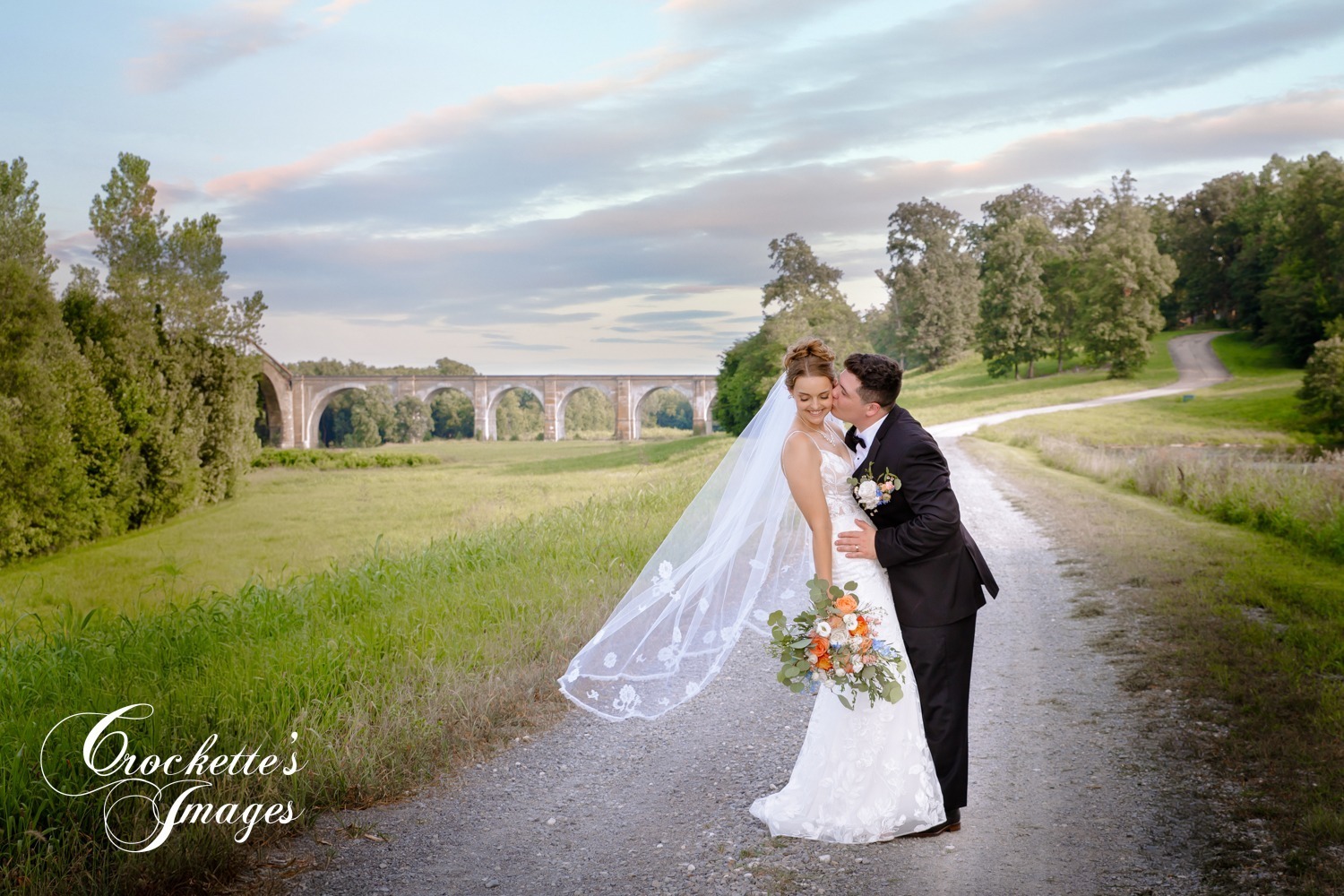 Fun and Elegant Wedding Photos at Amor on The River in Scott City, MO. Long veil photos