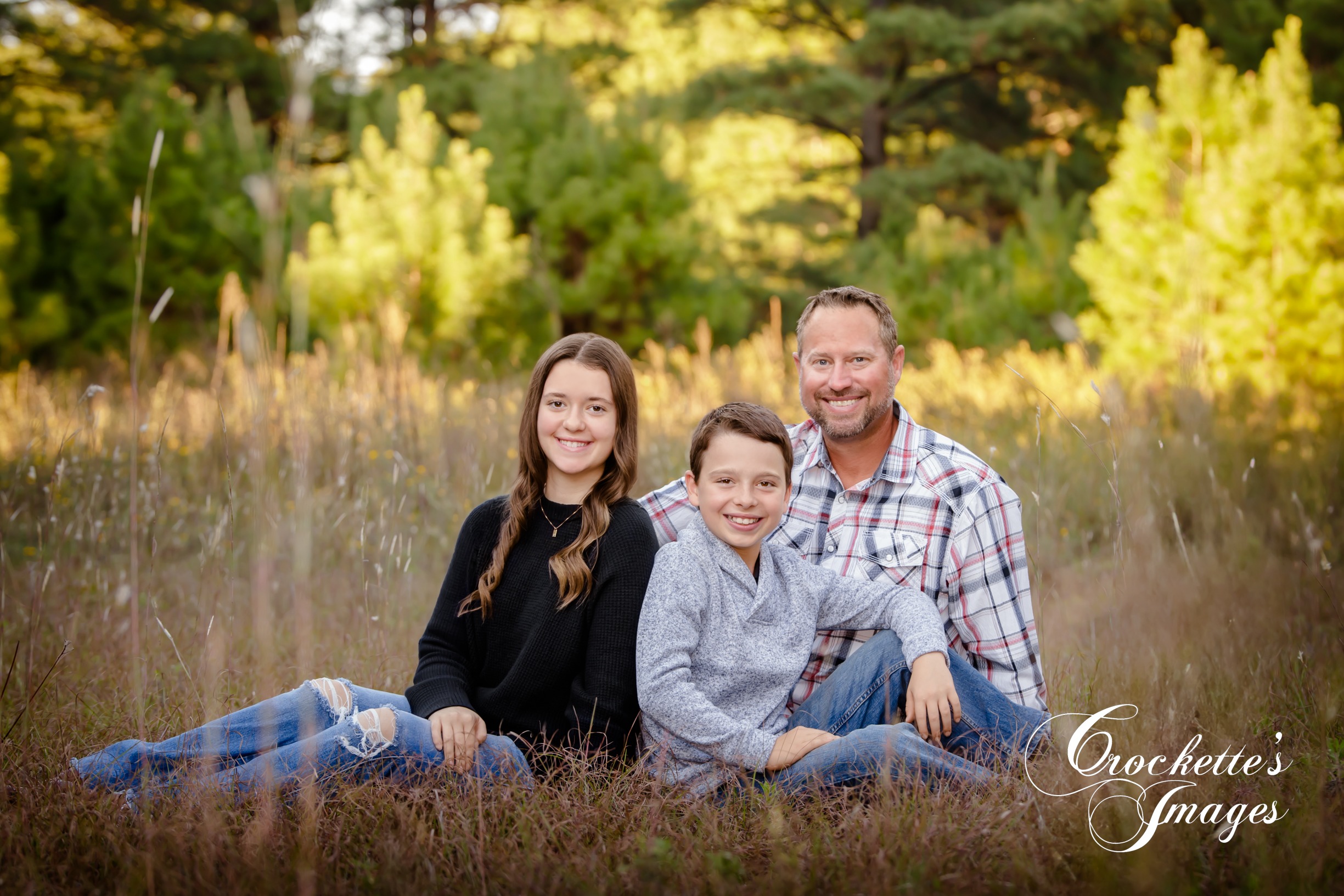 Country Family Photo in a grassy field. Black, gray, and plaid color scheme.