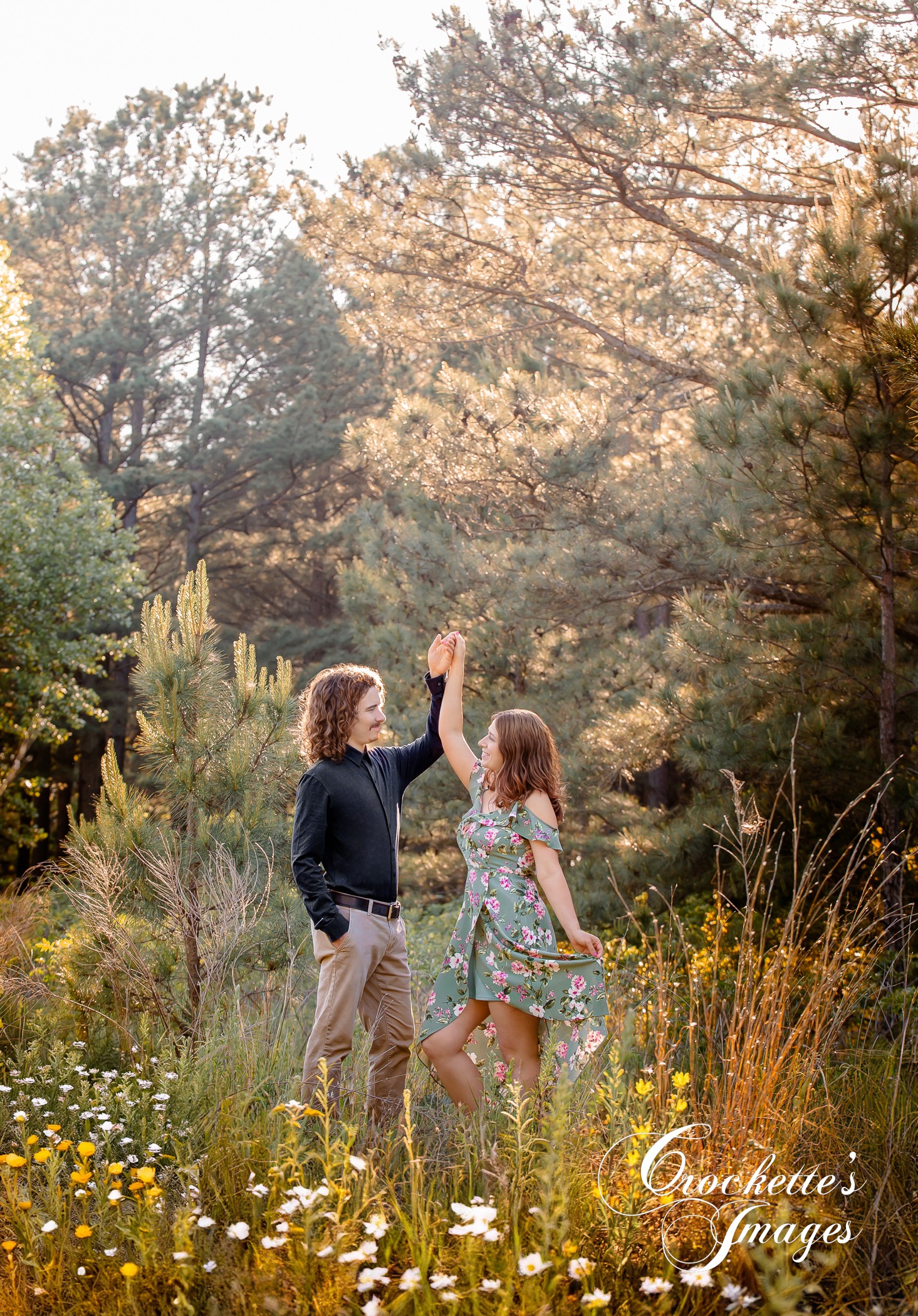 Spring Engagement photos in a pine tree flower field