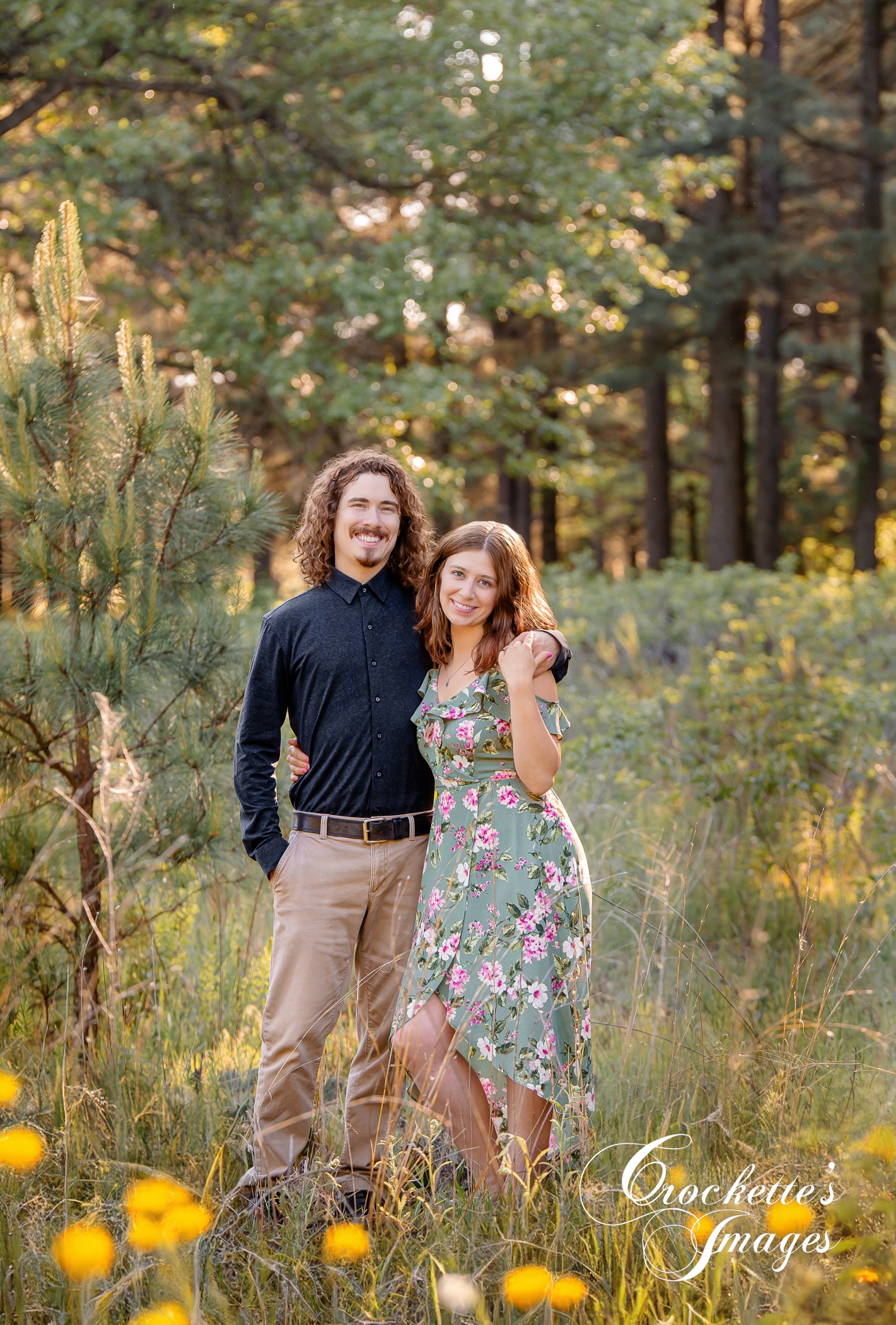 Spring Engagement photos in a pine tree flower field