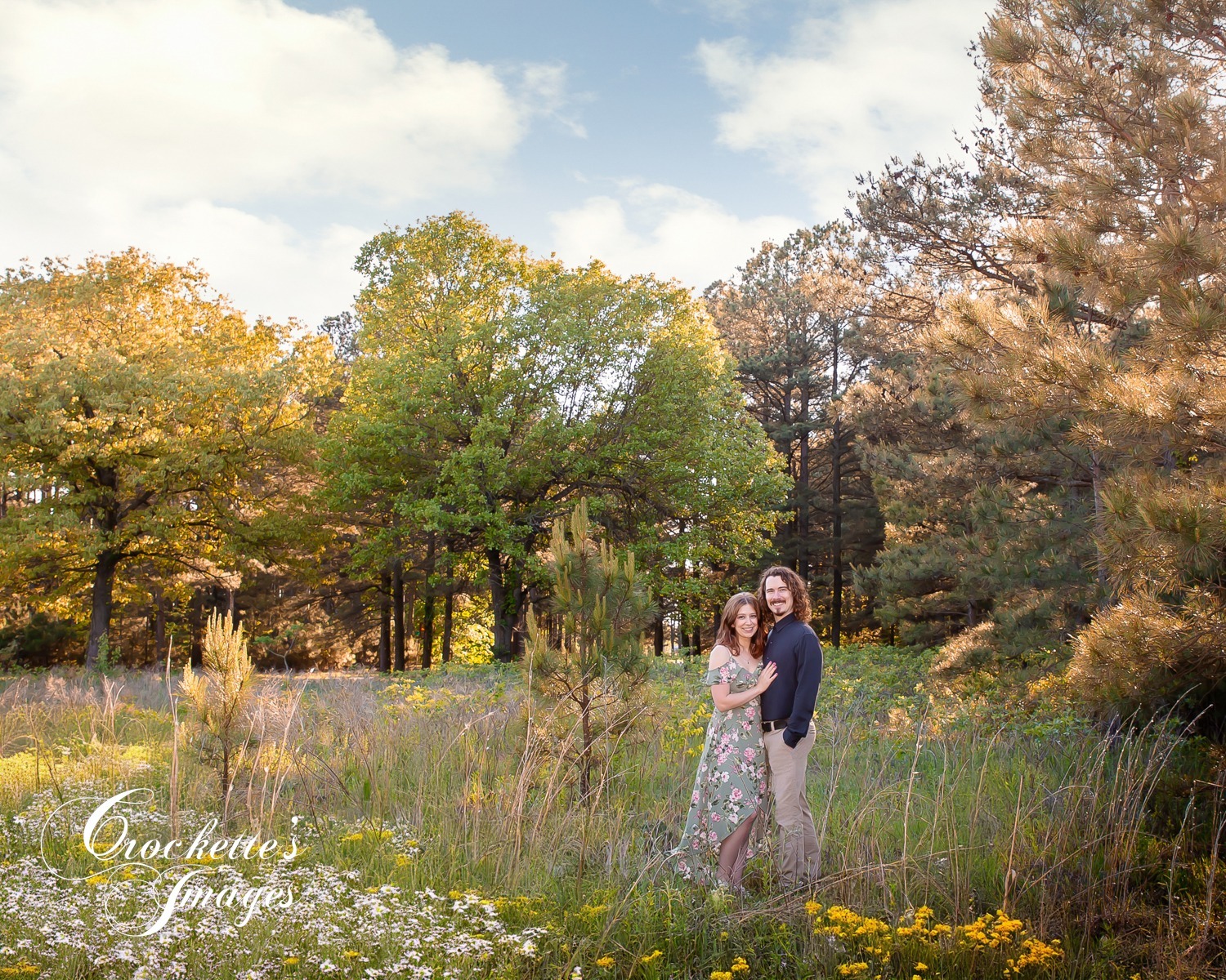 Spring Engagement photos in a pine tree flower field