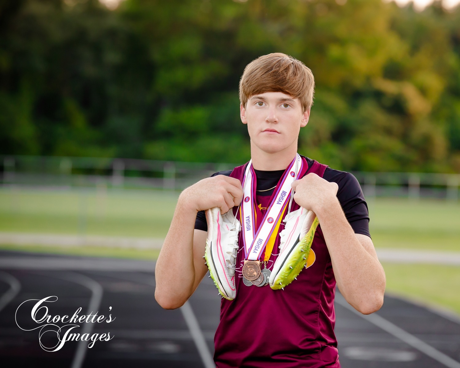 Creative track, running, sports Senior Photos with shoes and medals. Kelly High School Senior