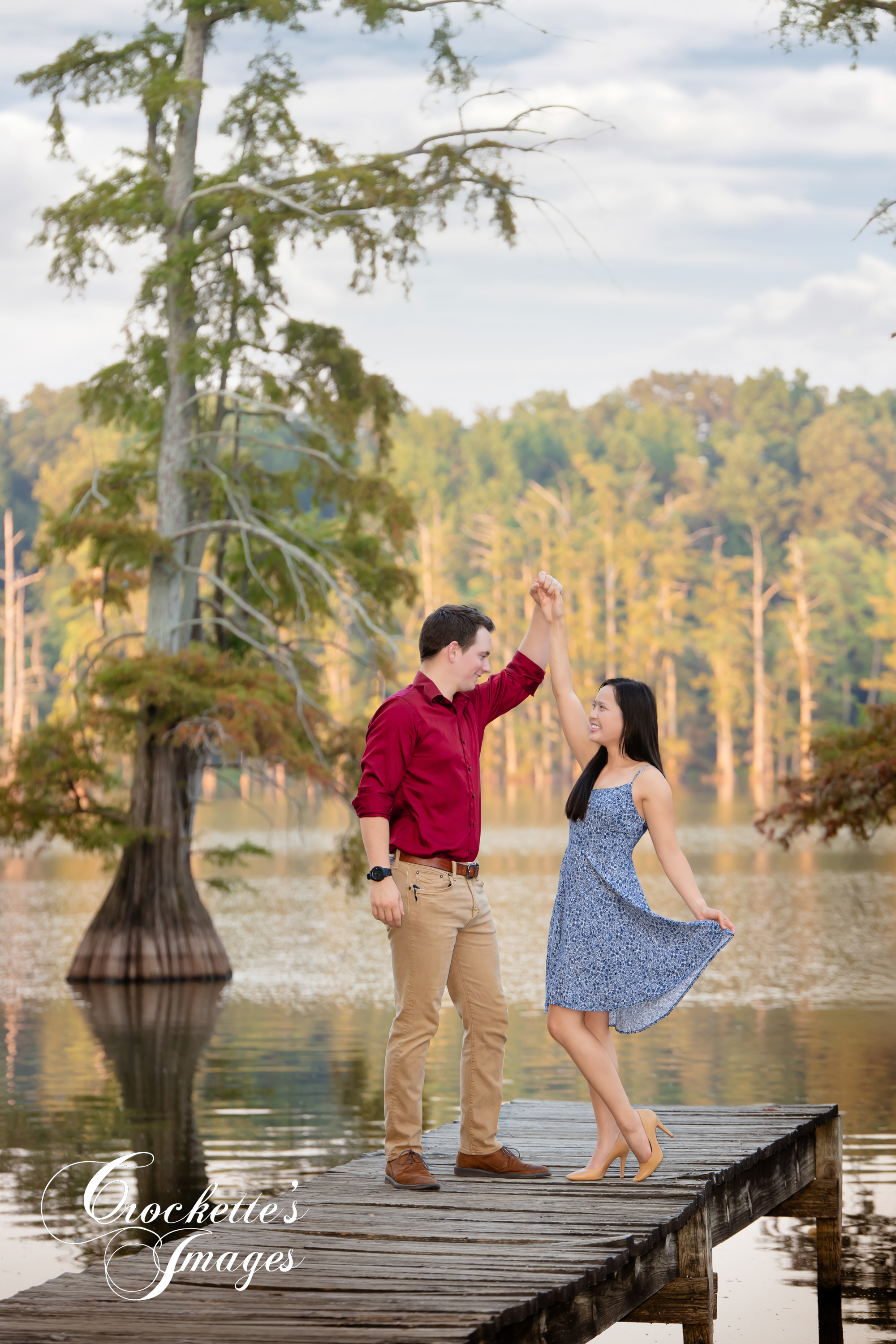 Classy, Elegant, Fall Engagement Session on the lake surrounded by cypress trees. Blue, and maroon clothing color scheme.