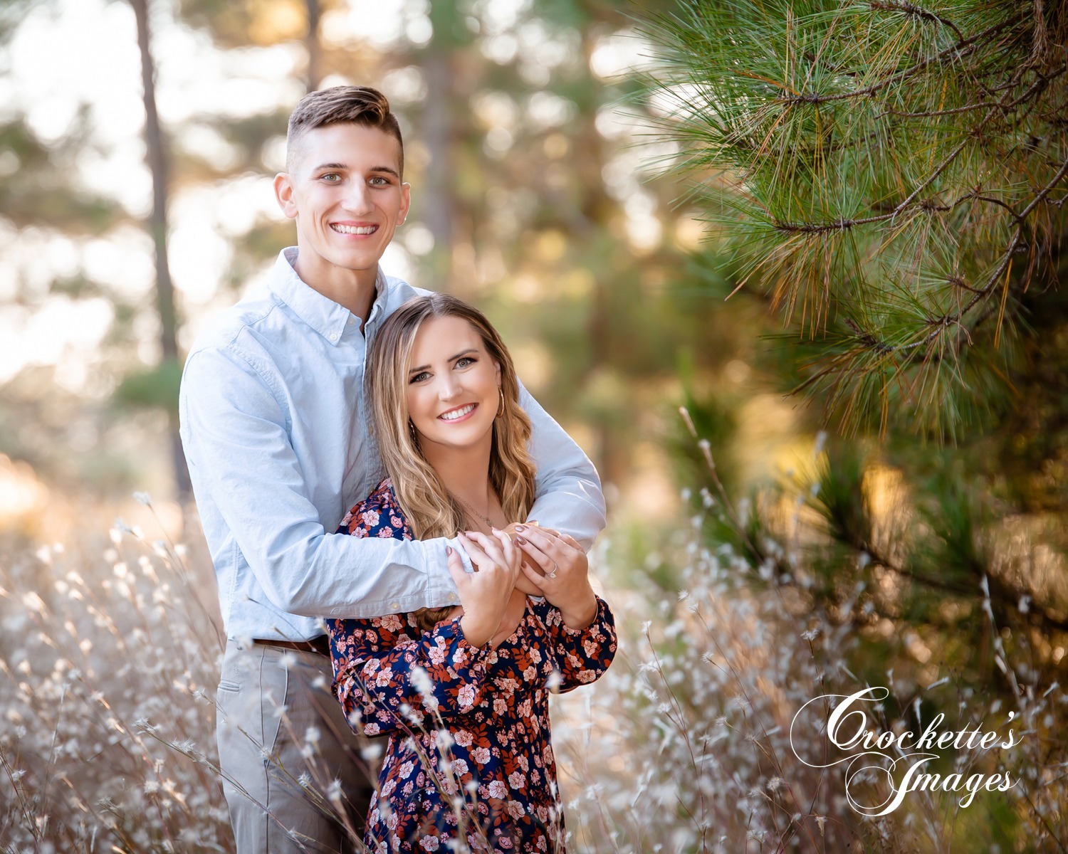 Classy, emotional, elegant engagement photos in a pine forest. Light blue and floral clothing color scheme