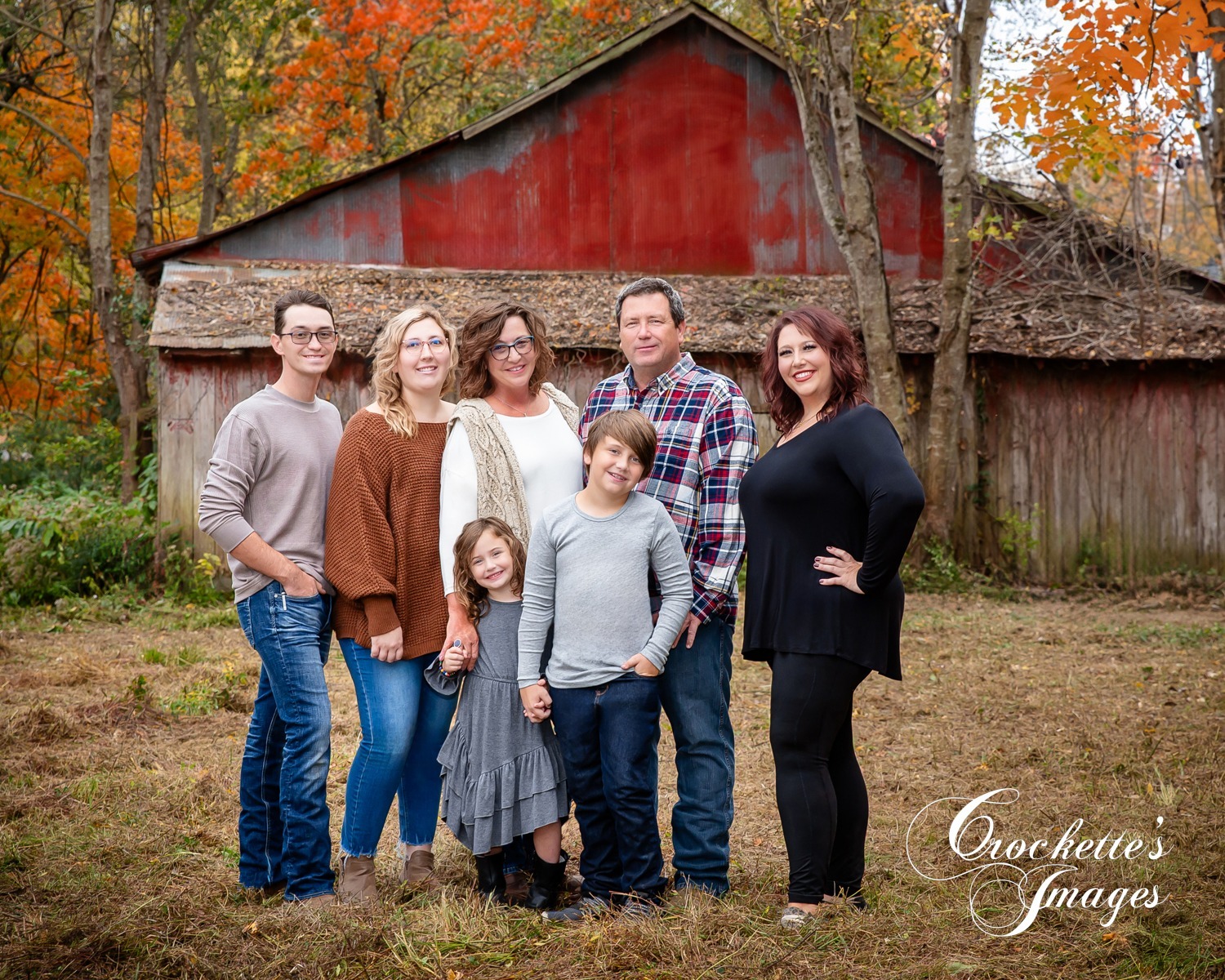 Farm Family Photos with a barn. Black, Gray, and rust color clothing scheme