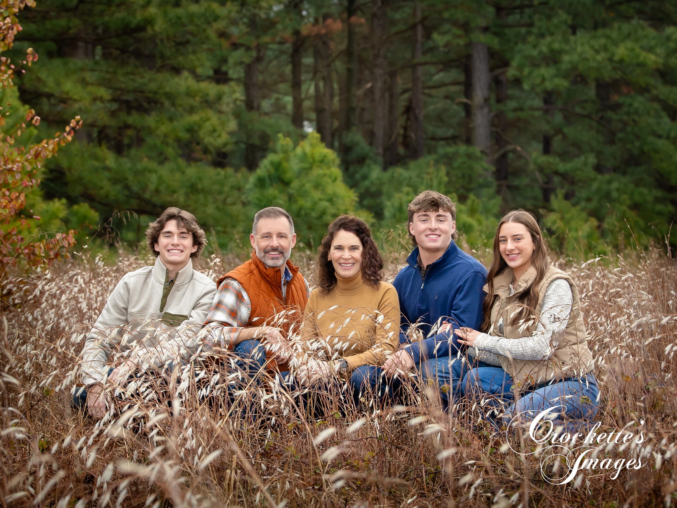 Fall family photos in a grassy field