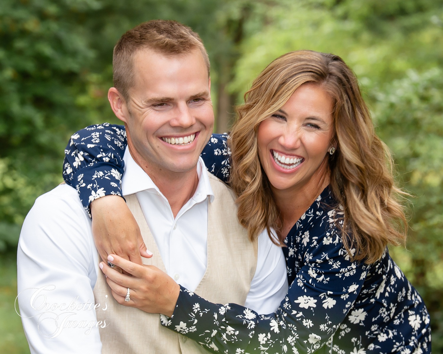 Super fun engagement photo with couple laughing together