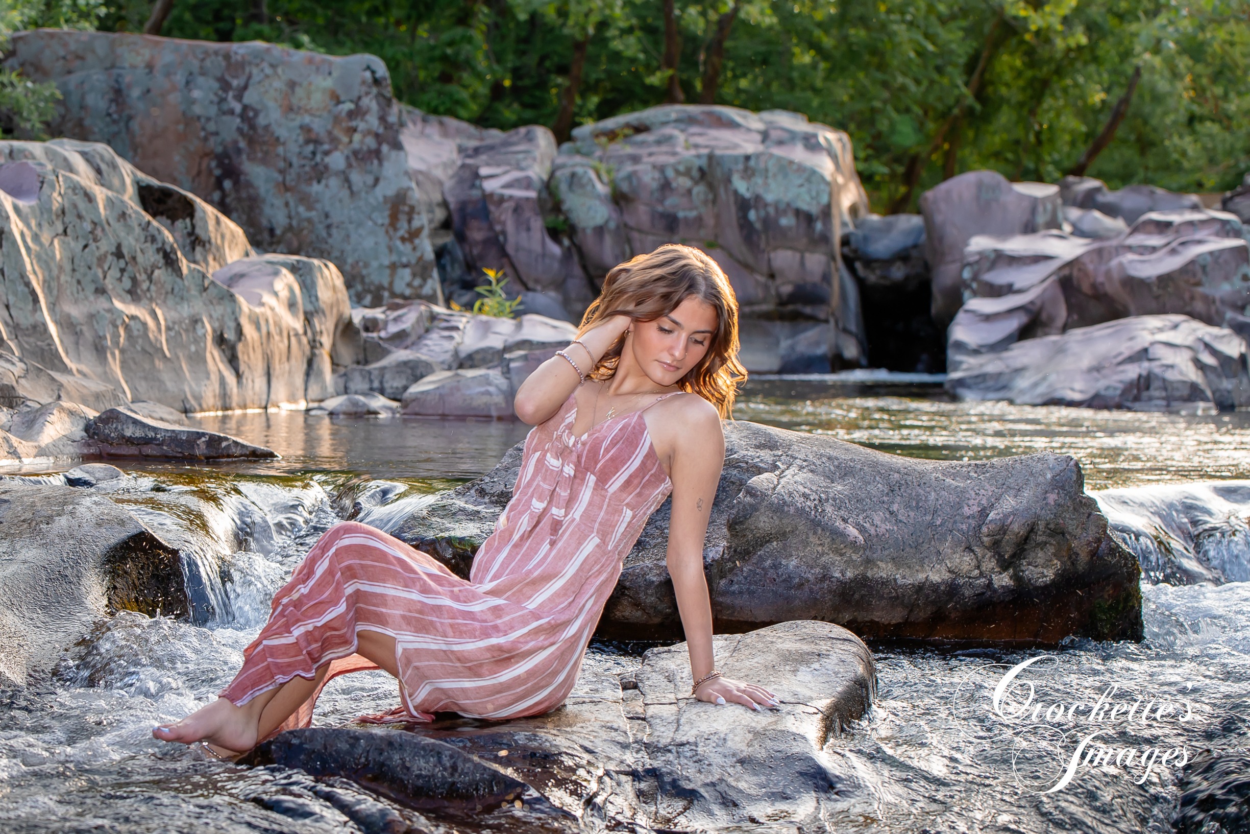 High School Senior Photo of a girl in a big creek