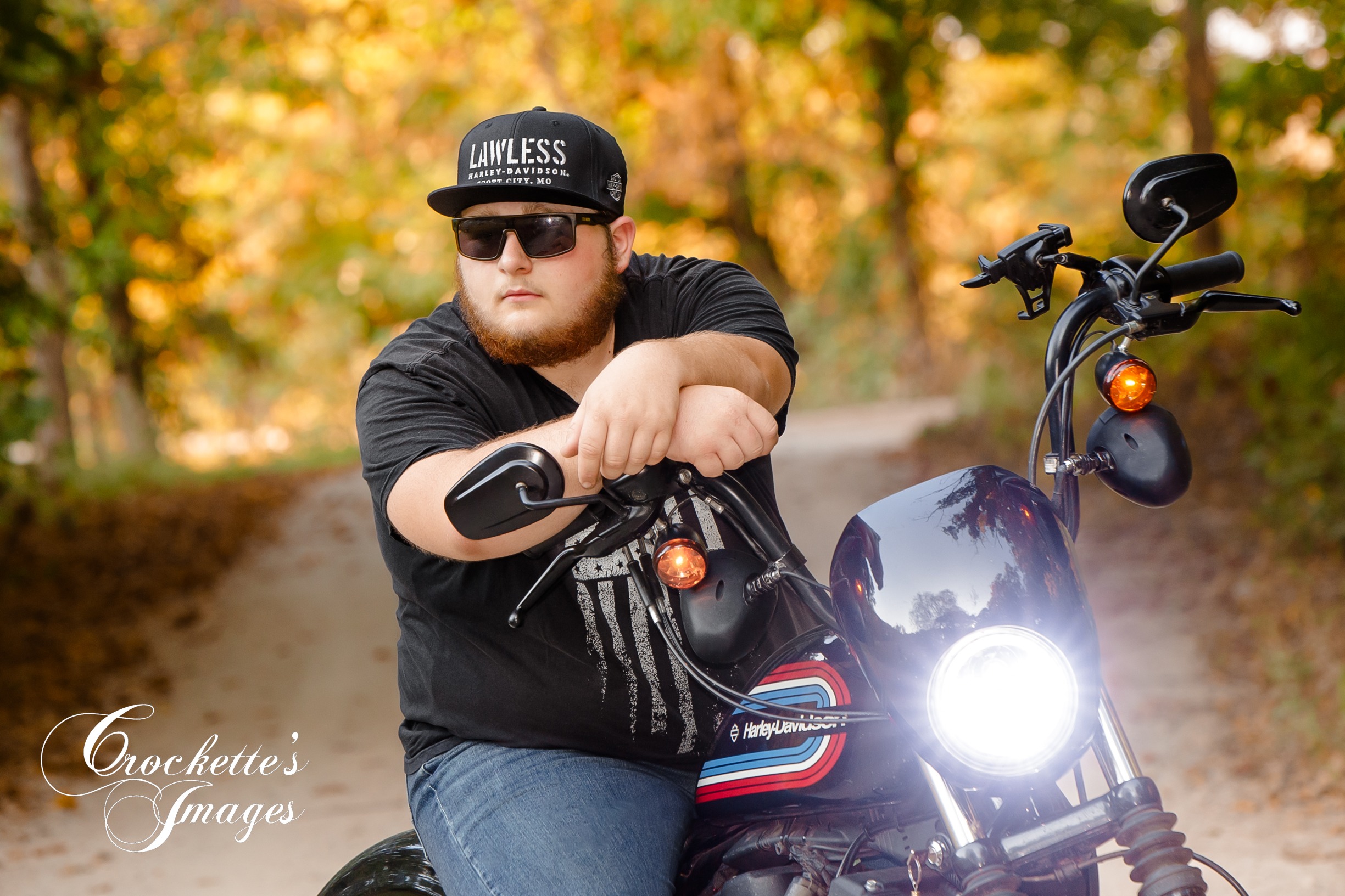 High School Senior of a boy on his Harley Motorcycle with hat and sunglasses