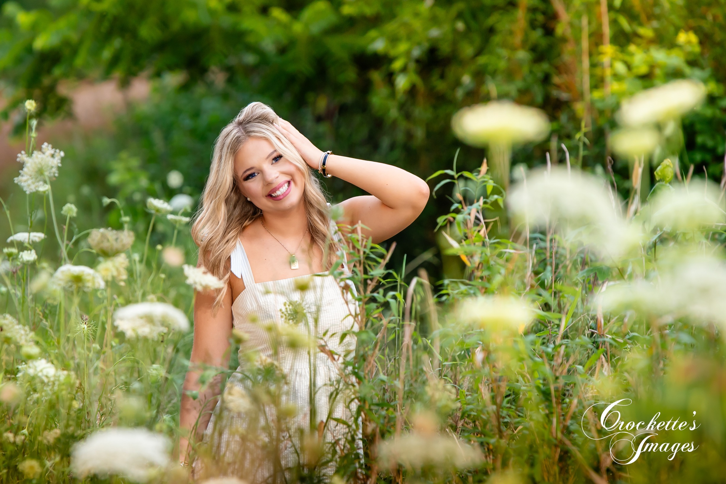 Country Senior Photo in a flower field with Crockette's Images