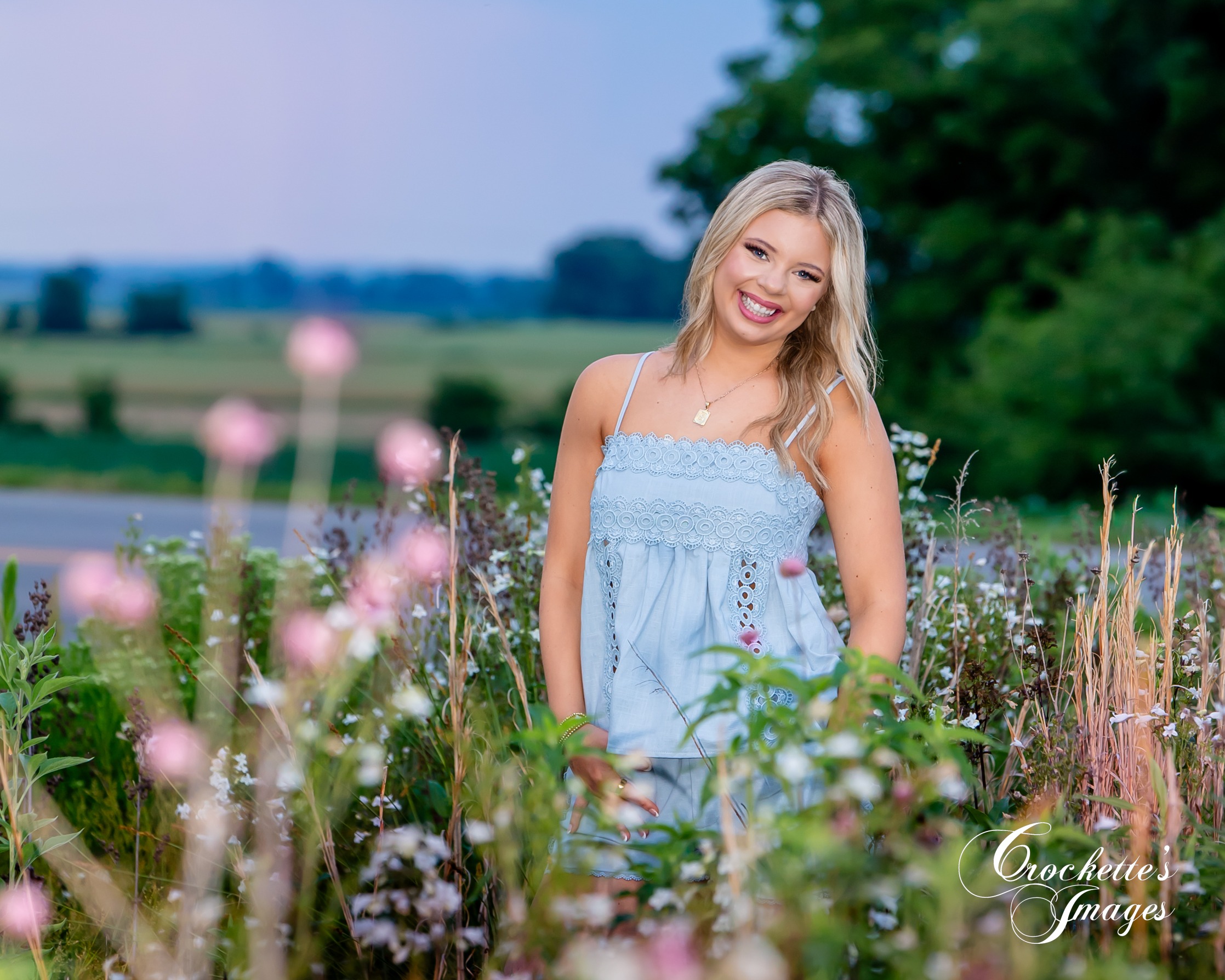 Country Senior Photo in a flowerfield with Crockette's Images