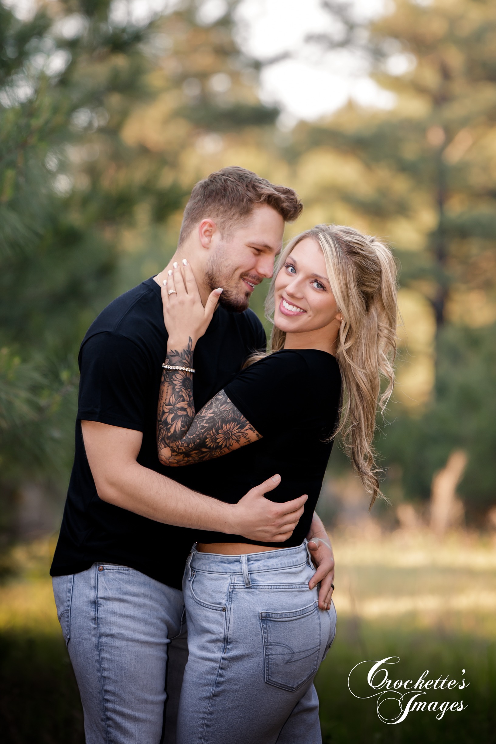 Engagement photo with Crockette's Images in a pine tree forest