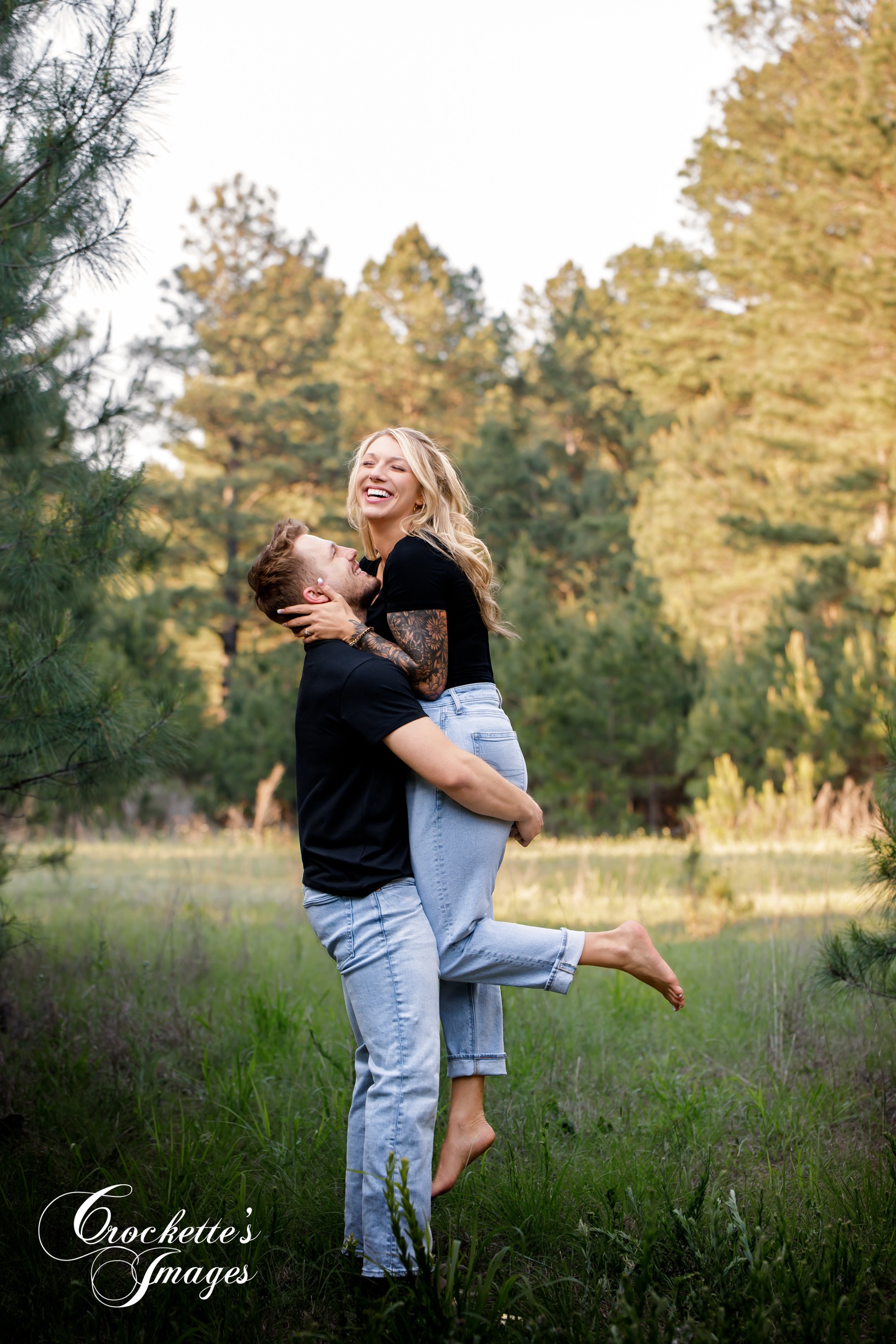 Engagement photo with Crockette's Images in a pine tree forest