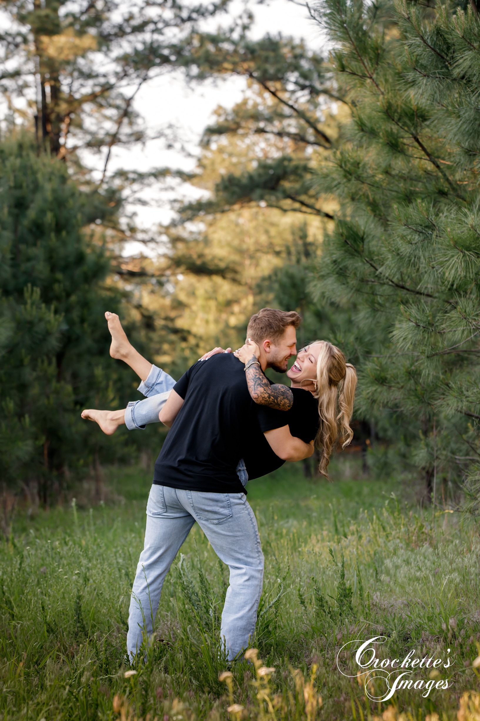 Engagement photo with Crockette's Images in a pine tree forest