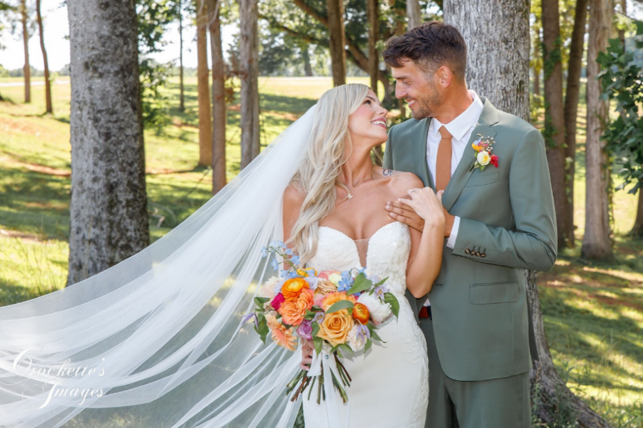The Best Odd Little Tips to Keep You Comfy on Your Wedding Day 1 Bride gazes adoringly at her groom as they pose for a romantic outdoor wedding portrait on a warm summer day.
